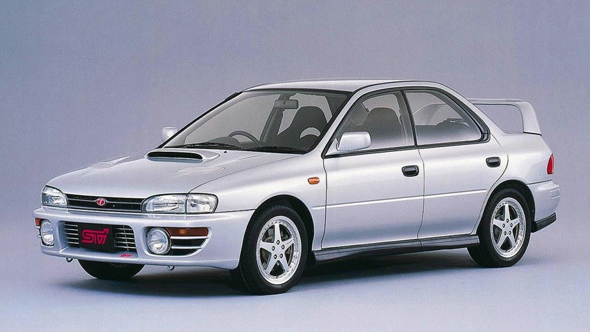 The very first STI models were created by pulling existing WRXs off the assembly line and strengthening their mechanicals. Special, hardcore models of the WRX had existed right from 1992, but the first proper STIs had further upgrades. Version 1 cars saw front strut tower bars made of carbonfibre, forged pistons, and better intercooling. The 2.0L flat-four powerplant made 250 hp in JDM trim, thanks to their readily available high-octane fuel.