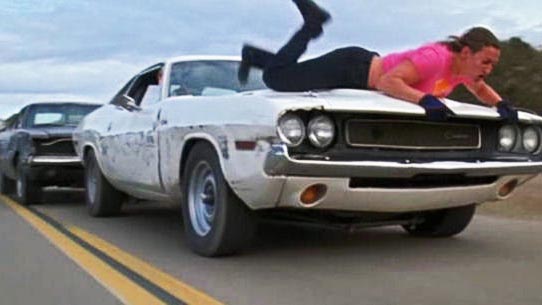 You want to hate Kurt Russell’s Stuntman Mike – he does some pretty abhorrent things – but when you see him chasing a car full of joyriders, one of whom has <em>voluntarily strapped herself to the hood of a speeding muscle car</em>, well, you realize he’s just doing Darwin’s work. By the end of it, you actually kinda feel sorry for the guy.