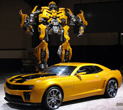 The most memorable scene in Michael Bay's first Transformers movie was when Bumblebee, the smallest of the Autobots, shed his beaten-up classic 1977 Chevrolet Camaro frame and evolved himself into a sleek, shiny brand-new Chevy Camaro. Okay, the new look breaks with the "humble hero" aspect of his character, but the sequence just looked so darn cool. Eagle-eyed viewers may have also noticed that all the Autobots were GMs (except, of course, Optimus Prime), while the Decepticon bad guy Barricade was a Saleen S281 (a variation of a Ford Mustang).