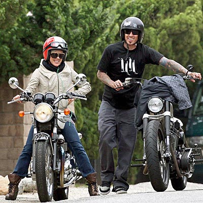 Obviously Pink's husband, motocross racer Carey Hart is going to ride a bike on the streets. That's just who he is. And what she is, is someone it's impossible to imagine sitting behind him with her arms meekly wrapped around his waist. So, she has her own ride, and you know what? I bet she challenges him to races all the time.