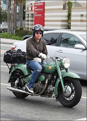 Back in 2004, over the course of 3 1/2 months, Ewan McGregor rode his BMW motorcycle from London to New York, via Europe, Siberia and Canada, covering more than 22,000 miles (35,000km) as chronicled in the TV series and book titled Long Way Round. So it's safe to say the man knows how to handle a bike, even if he doesn't seem quite aware that there's no bridge between Russia and Alaska. But whatever, he got it done. More recently, he was spotted in LA on a vintage Sunbeam bike.