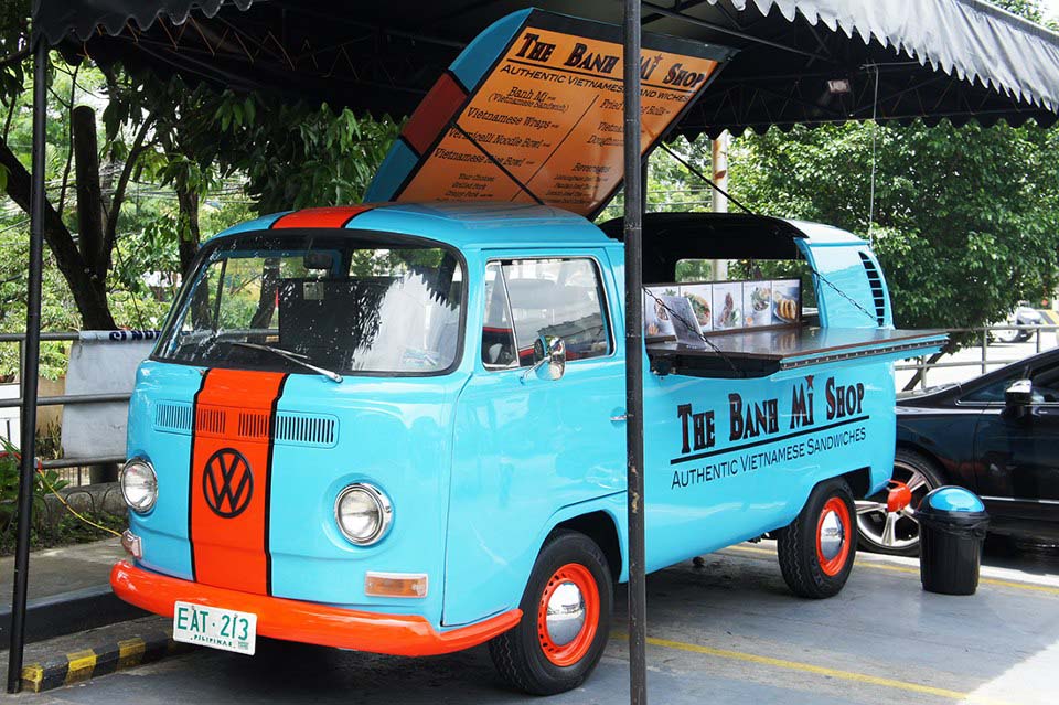 And because we have a fetish for converted old Euro-delivery trucks, this vintage VW Bus gets treated to a slick paint job with one of our favourite racing liveries (Gulf blue and orange) while serving delectable Banh Mi sandwiches and other Vietnamese delicacies in Quezon City, Philippines.