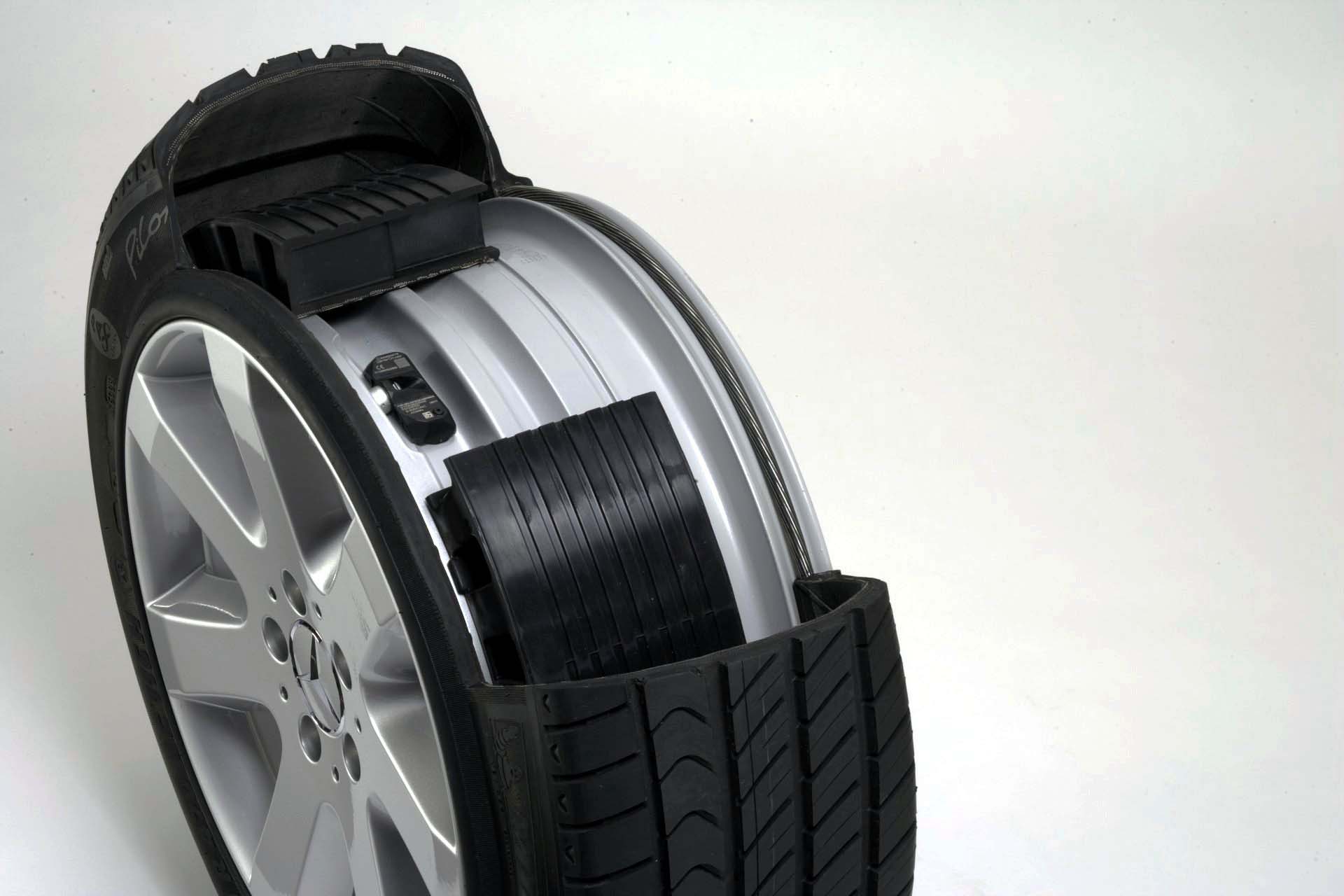 With run-flats, you can drive a limited distance at a limited speed after a loss of air, enabling you to limp your ride to a repair shop for a new tire, without having to install a spare. In this photo, we get a peek inside of a Bridgestone run-flat tire, and can see the support ring structure that holds the tire up if air is lost. Unfortunately, run-flats come with certain trade-offs, like a stiffer and noisier ride and higher replacement costs, while still being susceptible to sidewall flats.<br />
