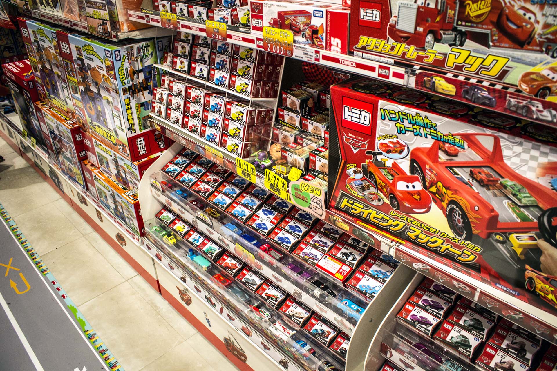 You can find Tomica cars at most toy stores in Japan, but they also have dedicated stores. This one was filled with playsets, including a full range branded with Disney's <i>Cars</i> movie.