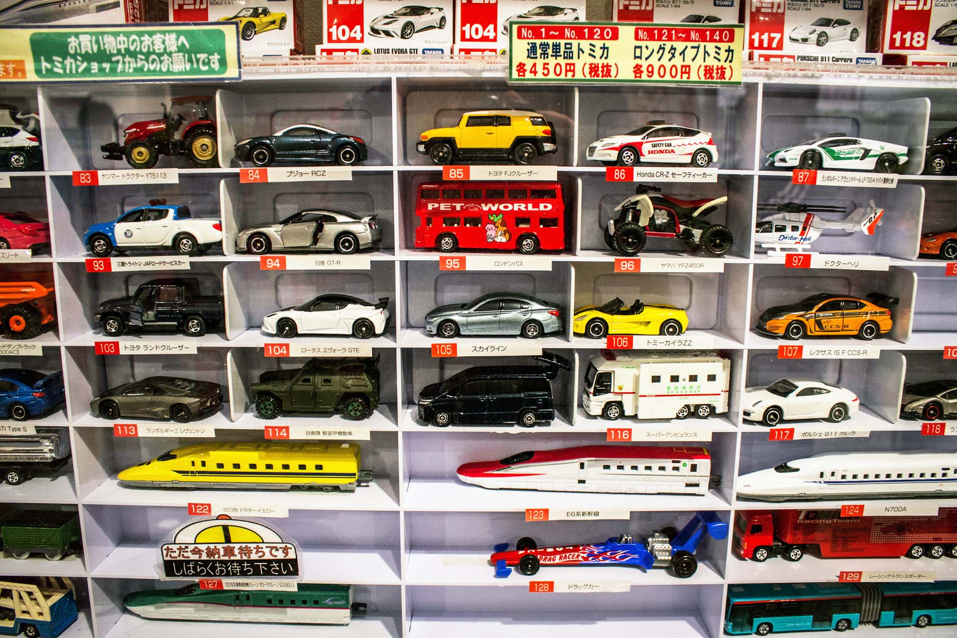 This is the standard lineup of Tomica cars. Pretty much every one of them has an opening door or hood or other function for a kid to play with. The longer versions feature bullet trains or transporter trucks and buses.
