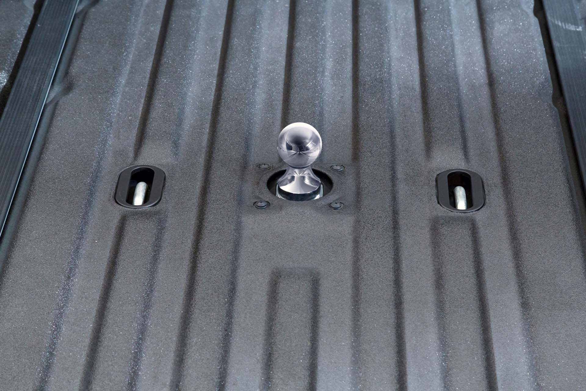 Most heavy duty trucks can be modified to pull a gooseneck hitch. But the installation comes at an extra cost and the protruding ball-hitch compromises the truck's payload. The Titan XD comes with a fully integrated frame-mounted gooseneck hitch with a removable ball so as not to interfere with the bed’s capacity. The hole has a cover for messy loads like mulch or straw. When not being used, the trailer hitch can be stowed in a lockable cargo box beneath the rear seats.