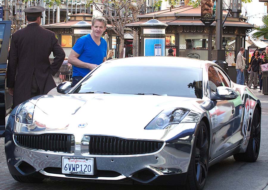 However, despite his love of Ferraris, Ramsay remains willing to admire other automobiles. Here, he checks out Justin Bieber's Fisker Karma. Similarly, you have to wonder if he can set his cordon bleu status aside and gaze longingly at Big Macs and cheeseburgers, while inside his soul he feels the tug of an unspeakable desire….