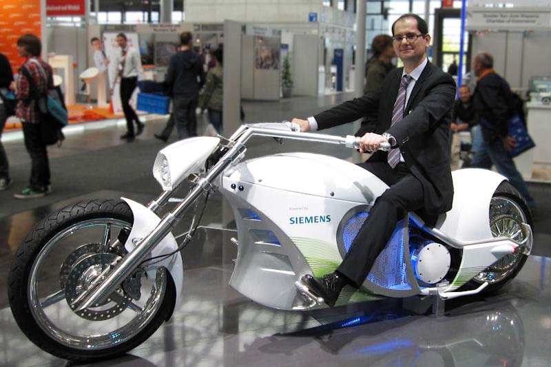 This is, so we're told, the first electric chopper ever built. At full charge, it has a range of 100 km, and can go up to 160 km/h. Of course, this chopper will save on fuel. It will especially save on fuel because no one will want to ride it. Seriously, though, it's great that electric choppers are starting to appear, and with luck future ones will appear a little more stylish, without the blatant corporate branding.