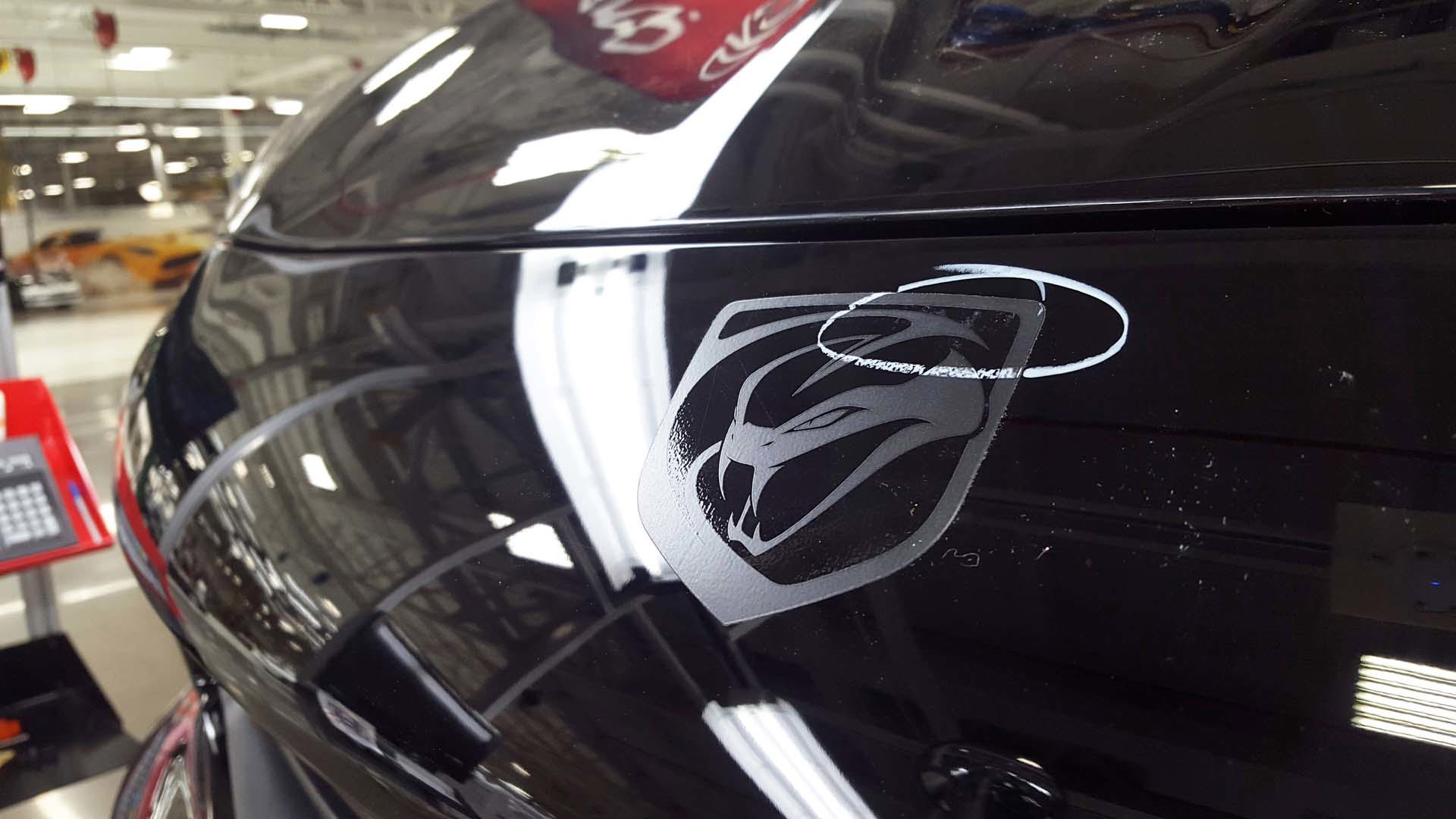 Anthony Thomas spotted a flaw. Circled with his wax crayon is a small imperfection in the lightweight sticker-badge on the front of this customer’s new Viper ACR. No matter how small, pride in their work means Viper’s creators do things right – including having this sticker removed and replaced.