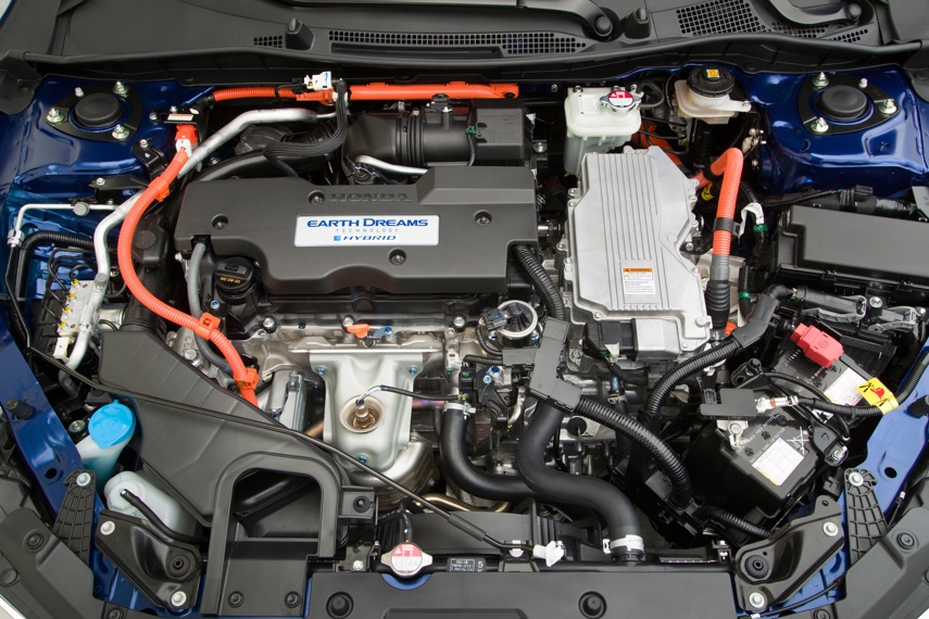 The power control unit is the silver-coloured device next to the engine.