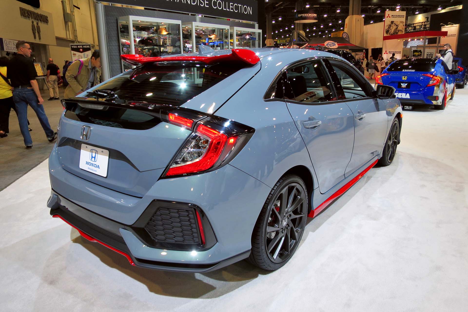 The Honda Civic Hatchback is displayed with all of its new optional accessories painted red.