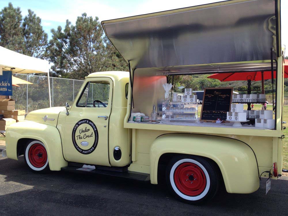 We also love us some vintage pickups, and this pie truck, Under the Crust, takes one of our favourites, a second-generation Ford F-Series (we think it’s a ’55 F-100…) and sets up a simple, classy display for some tasty pies atop its truck bed.