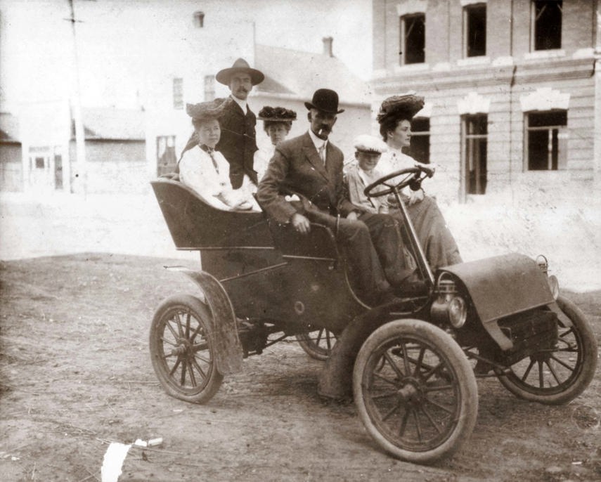 The Morris family enjoying an open-air drive along Jasper Avenue in the first car registered in Alberta. 