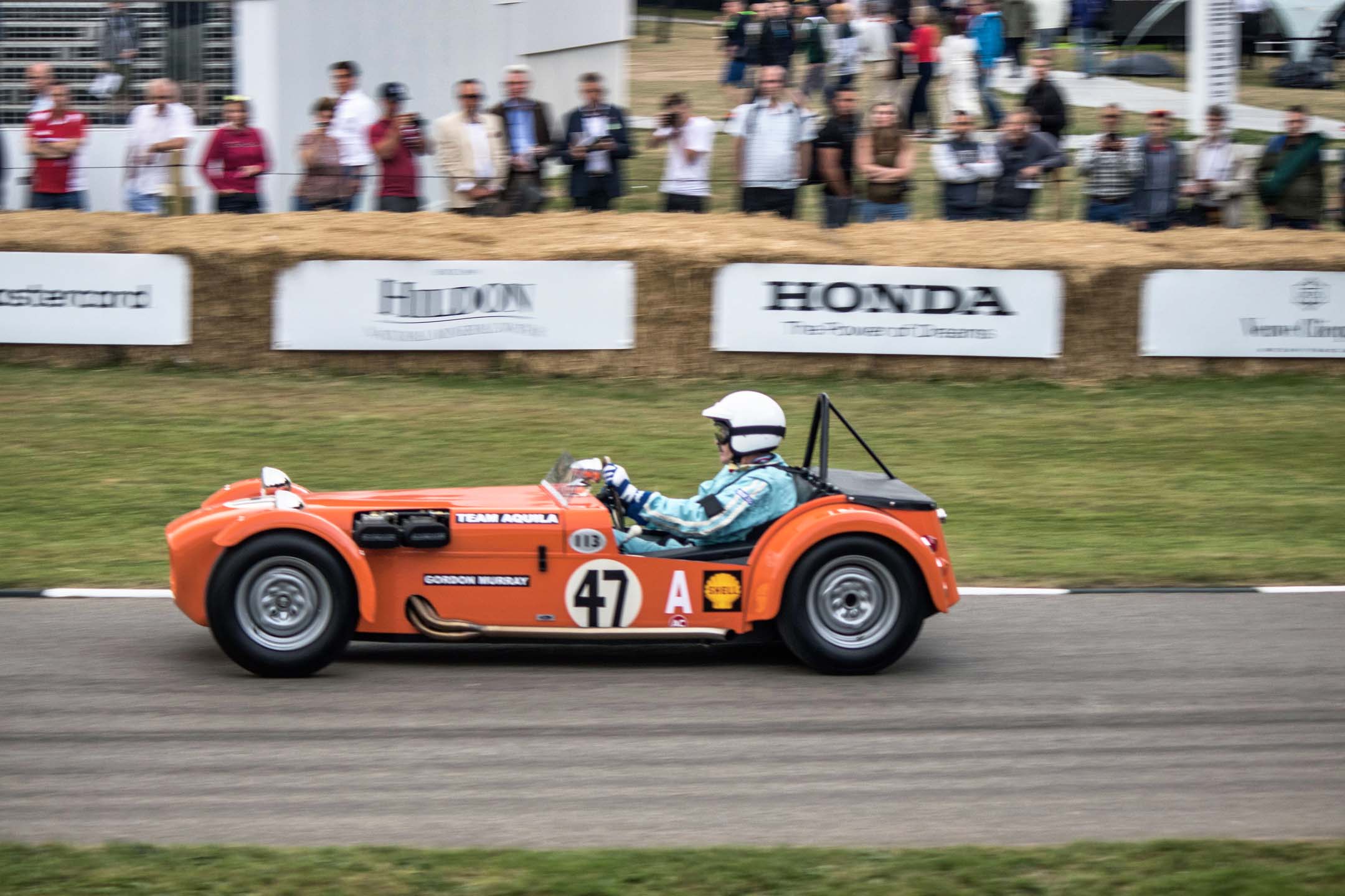 Noted car South African designer Gordon Murray goes up the hill in a Lotus Super Seven clone he built in his youth. Famous for many Brabham Formula One builds and the McLaren F1, Murray was surrounded by many of his own designs on the day.
