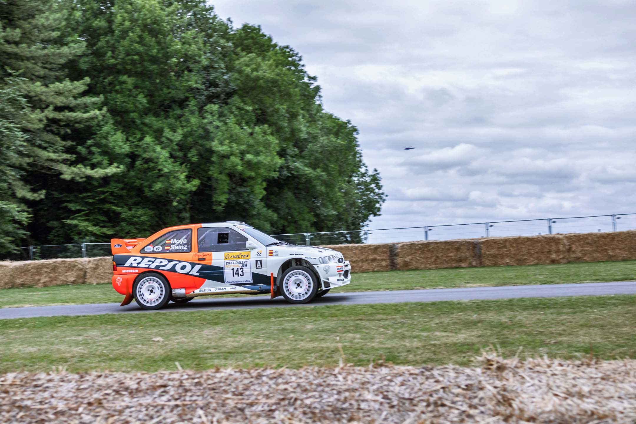 The rally machines go up the hill too, and are often among the fastest cars to do so. This Escort Cosworth still has the names of WRC champion Carlos Sainz and co-driver Luis Moya on the back window.